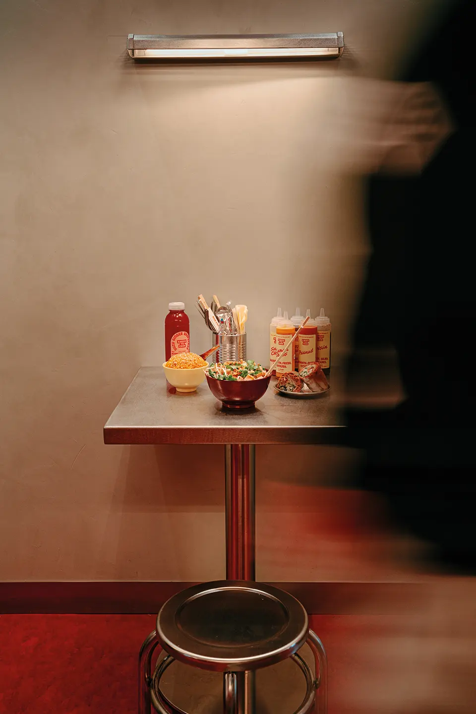 Knees to chin restaurant table with products
